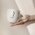 Kubek 300 ml - Lew / Leo Kubek porcelanowy ze złotym zdobieniem Lew / Leo Nadzwyczajnie.pl — widok z boku na białym tle