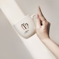 Kubek 300 ml - Panna / Virgo Kubek porcelanowy ze złotym zdobieniem Panna / Virgo Nadzwyczajnie.pl — widok z boku na białym tle