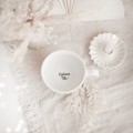 Biały kubek porcelanowy 500 ml - złote serce z napisem Zostaniesz tatą na dnie dla przyszłego taty na ogłoszenie ciąży Zbliżenie na złote zdobienie serca na białym kubku porcelanowym + Zostaniesz tatą NAPIS NA DNIE Nadzwyczajnie.pl