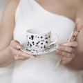 Ręcznie malowana filiżanka 200 ml ze spodkiem z CIENKIM RANTEM - Czarne kropki ZDOBIONA ZŁOTEM Biały filiżanka porcelanowa Nadzwyczajnie.pl ze złotym zdobieniem i napisem Ręcznie malowana ze spodkiem z CIENKIM RANTEM