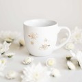 Kubek 300 ml - Złote stokrotki Biały kubek porcelanowy Nadzwyczajnie.pl ze złotym zdobieniem i napisem Złote stokrotki — 300 ml