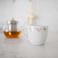 Kubek 300 ml - Parisian amour Zbliżenie na złote zdobienie na białym kubku porcelanowym Parisian amour Nadzwyczajnie.pl