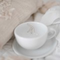 Filiżanka 250 ml ze spodkiem - Legs Biały filiżanka porcelanowa Nadzwyczajnie.pl ze złotym zdobieniem i napisem ze spodkiem - Legs — 250 ml