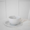 Filiżanka 250 ml ze spodkiem - Legs Filiżanka porcelanowa ze złotym zdobieniem ze spodkiem - Legs Nadzwyczajnie.pl — widok z boku na białym tle