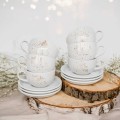 Zestaw deserowy na 6 osób - NAKRAPIANE ZŁOTEM Zbliżenie na złote zdobienie na białym zestawie porcelanowym deserowy na 6 osób - NAKRAPIANE ZŁOTEM Nadzwyczajnie.pl