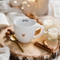 Biały kubek porcelanowy 300 ml - motyw złotego serca z napisem Spokój dla bliskiej osoby na każdą okazję Biały kubek ze złotym sercem Nadzwyczajnie.pl Spokój — porcelana premium 300 ml na prezent