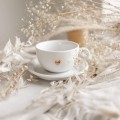 Biała filiżanka porcelanowa ze spodkiem 250 ml - złote serce i napis na dnie mam w sobie siłę dla kobiety na dzień kobiet Filiżanka porcelanowa ze złotym sercem ze spodkiem - + mam w sobie siłę NAPIS NA DNIE Nadzwyczajnie.pl — widok z boku na