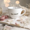 Kubek 500 ml - Może herbatki, kotku? Biały kubek porcelanowy Nadzwyczajnie.pl ze złotym zdobieniem i napisem Może herbatki, kotku? — 500 ml