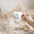 Biały kubek porcelanowy 300 ml - Złote serce i napis najlepszy ojciec chrzestny na chrzest dla ojca chrzestnego Kubek porcelanowy ze złotym sercem Najlepszy ojciec chrzestny Nadzwyczajnie.pl — widok z boku na białym tle