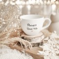 Kubek 500 ml - Pierwszy dzień taty ZŁOTE SERCE Zbliżenie na złote zdobienie serca na białym kubku porcelanowym Pierwszy dzień taty Nadzwyczajnie.pl